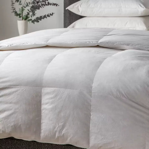 showing square patterned duvet on bed
