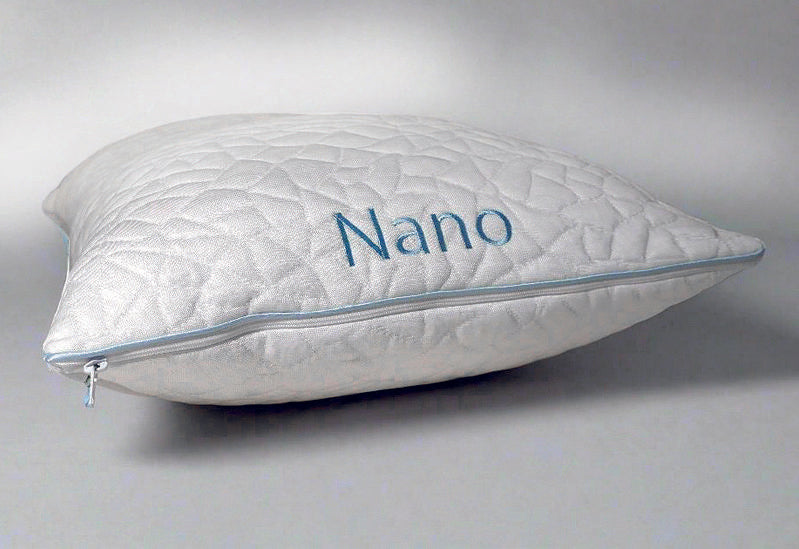White pillow with 'Nano' branding on a light gray background showing zipper