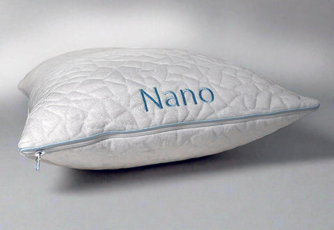 White pillow with 'Nano' branding on a light gray background showing zipper