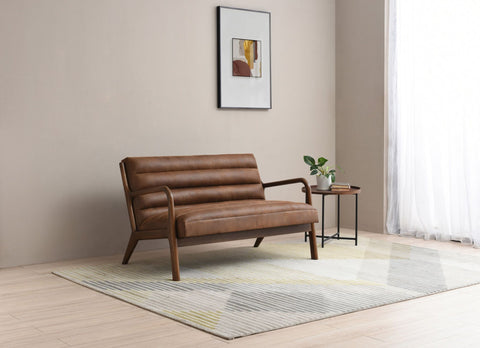 Inca 2 seater sofa in vegan friendly brown faux leather in a room setting