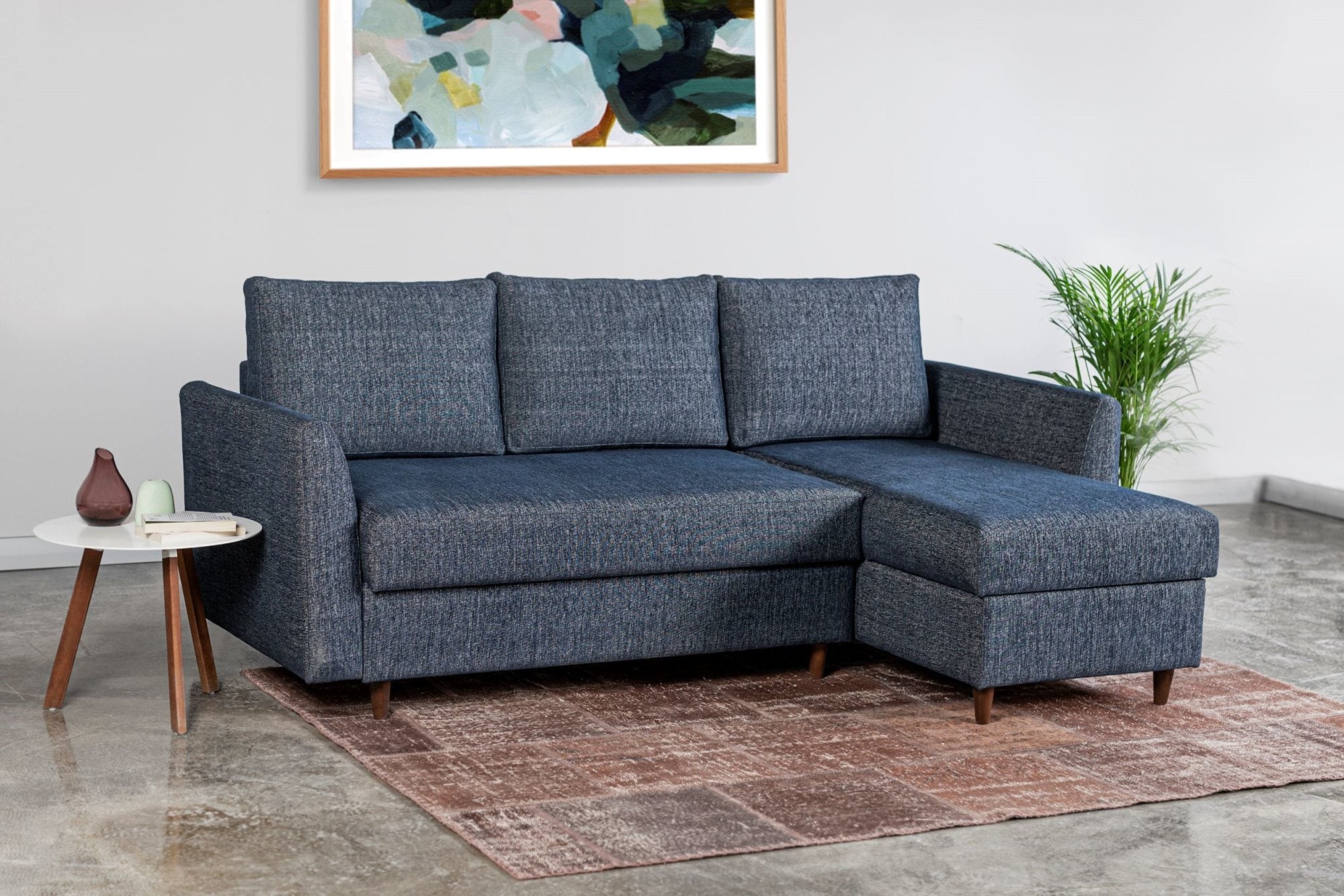 Brixham blue corner sofa bed with right hand ottoman storage in room setting