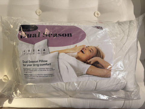 Packaged pillow with 'Dual Season' branding on a white background