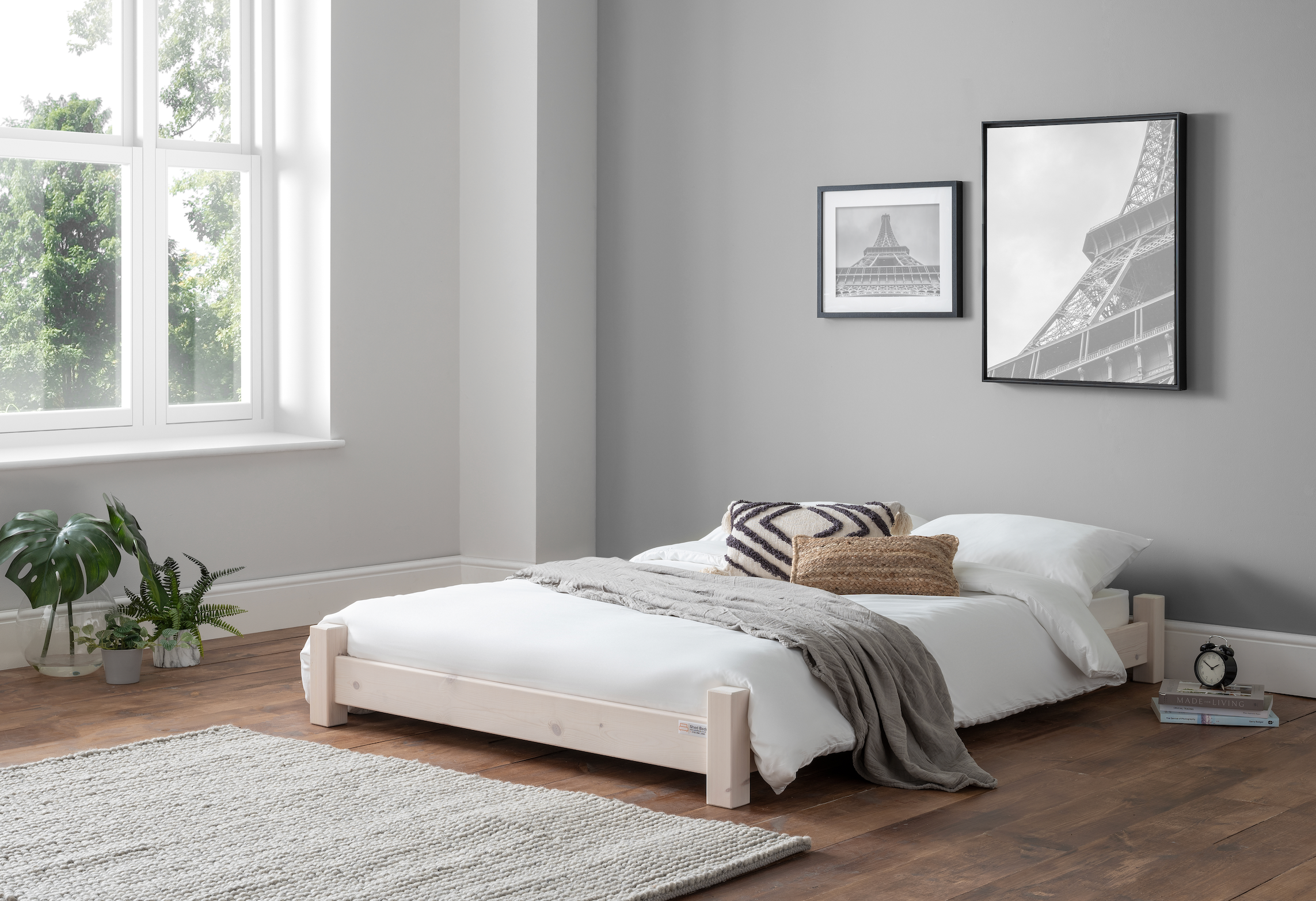 Low bed frame in "white" finish in room setting